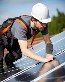 a man inspecting solar panel system